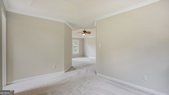 empty room with hardwood / wood-style flooring, crown molding, and a chandelier