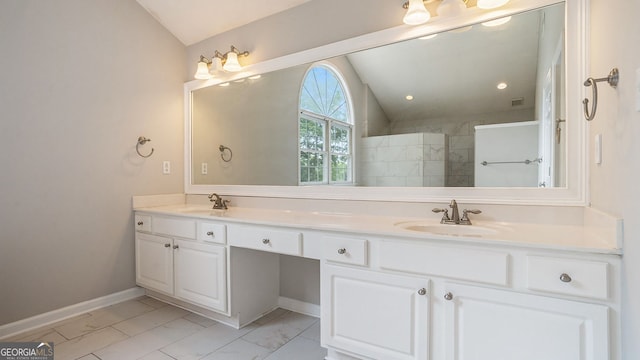 bathroom with walk in shower, vanity, and vaulted ceiling