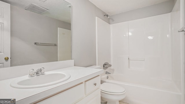 full bathroom with toilet, vanity, tub / shower combination, and a textured ceiling