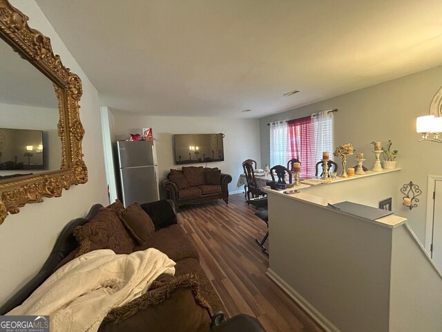 living room with dark wood-type flooring