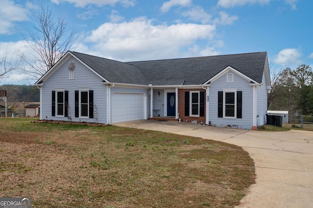 ranch-style home featuring a garage and a front yard