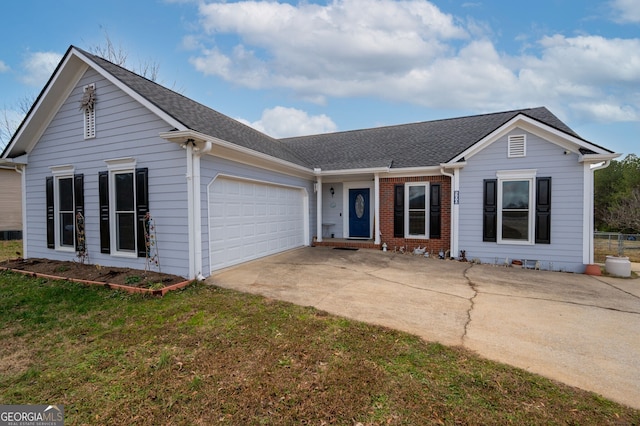 single story home featuring a garage and a front lawn