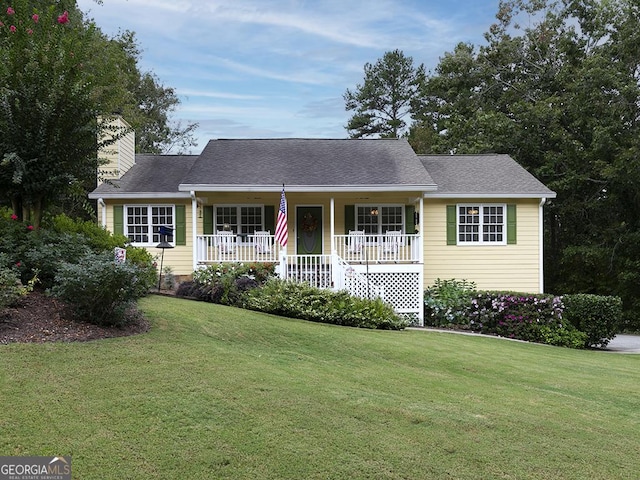 single story home with a front yard and a porch