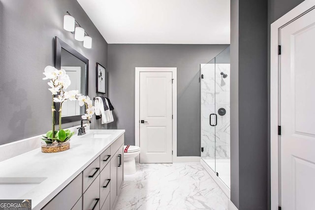 bathroom with vanity, toilet, and walk in shower