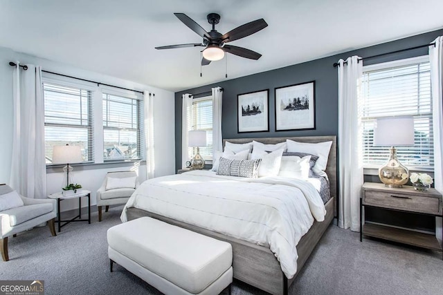 bedroom with ceiling fan and carpet