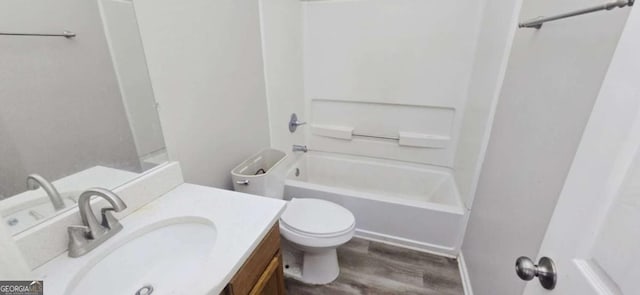 full bathroom with wood-type flooring, toilet, vanity, and shower / tub combination