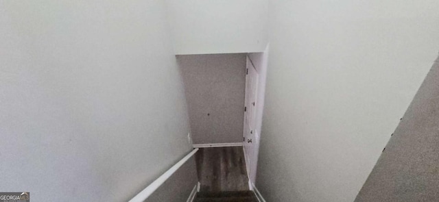 staircase featuring hardwood / wood-style floors