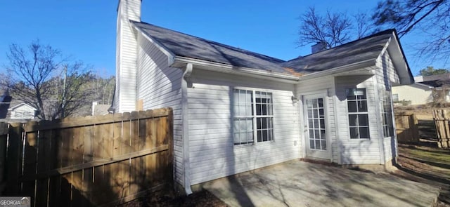 view of side of property featuring a patio