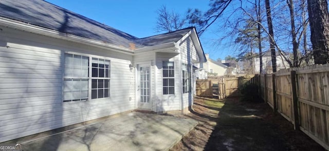 view of property exterior featuring a patio area