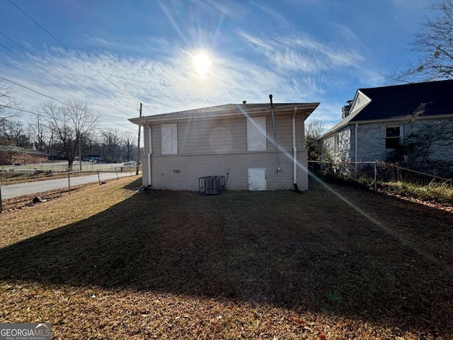 back of house with central AC