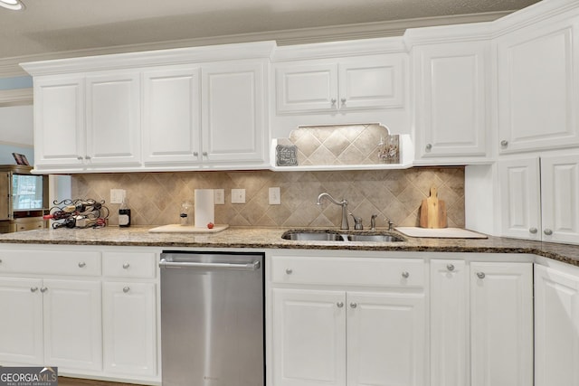 kitchen featuring sink, stainless steel dishwasher, white cabinets, and decorative backsplash