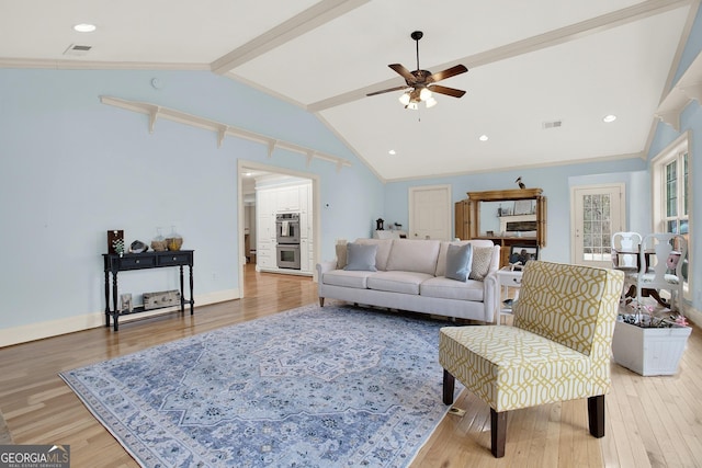 living room featuring hardwood / wood-style flooring, ornamental molding, vaulted ceiling with beams, and ceiling fan