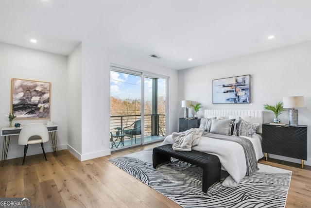 bedroom with access to exterior, recessed lighting, light wood-style flooring, and baseboards