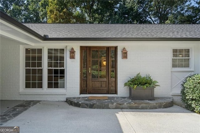 entrance to property with a patio