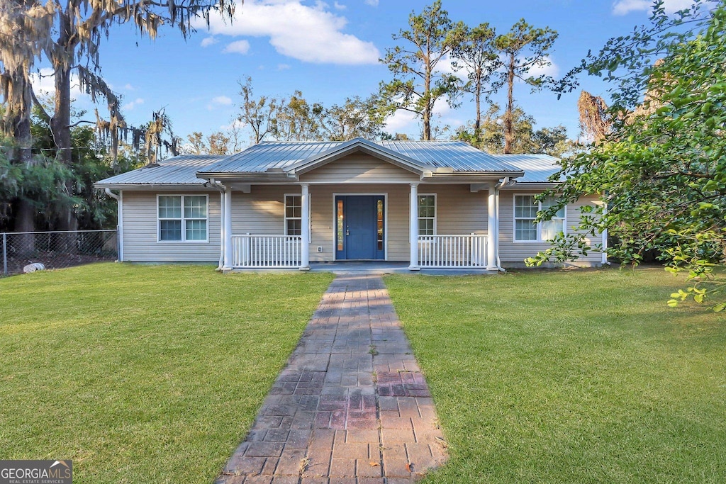 ranch-style home with a porch and a front yard