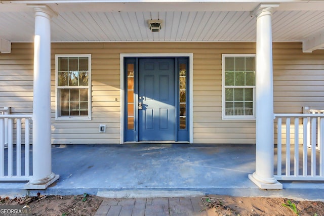 entrance to property with a porch