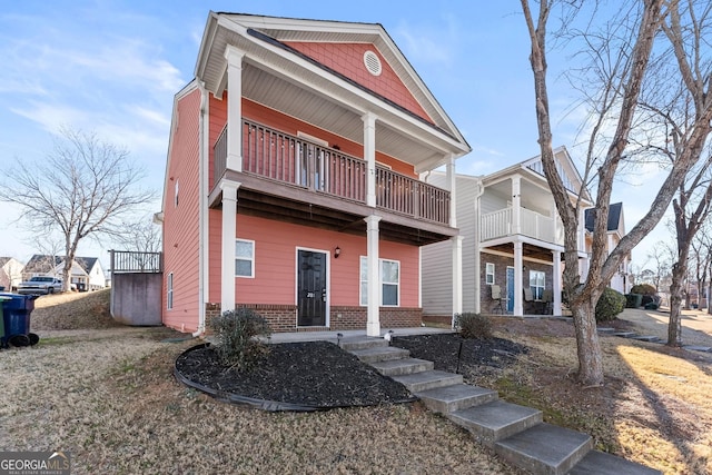 view of front of house with a balcony