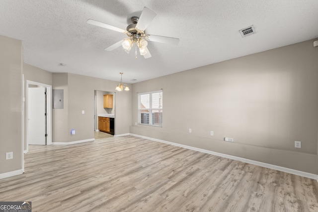 unfurnished living room featuring ceiling fan with notable chandelier, a textured ceiling, and light hardwood / wood-style flooring