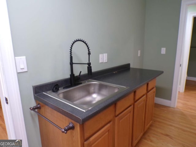 kitchen featuring light hardwood / wood-style floors and sink