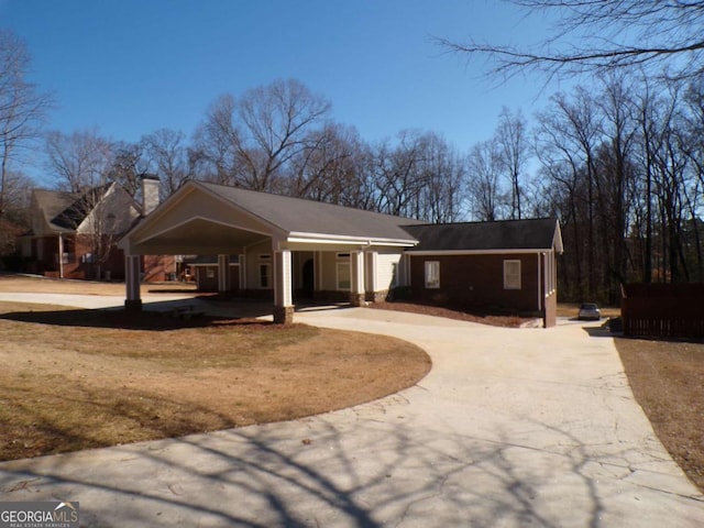 exterior space with a carport