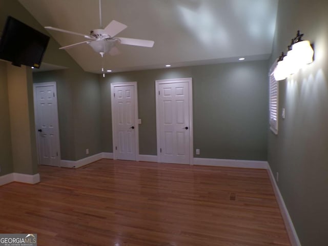 unfurnished room featuring ceiling fan and hardwood / wood-style floors