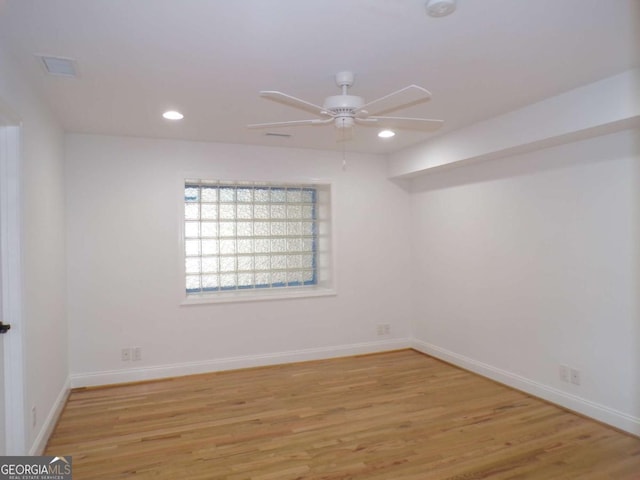 unfurnished room featuring light hardwood / wood-style floors and ceiling fan