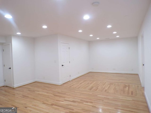 unfurnished room with light hardwood / wood-style floors