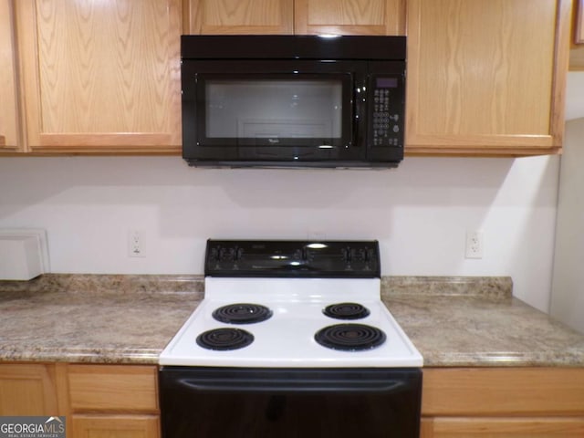 kitchen with range with electric stovetop and light brown cabinets