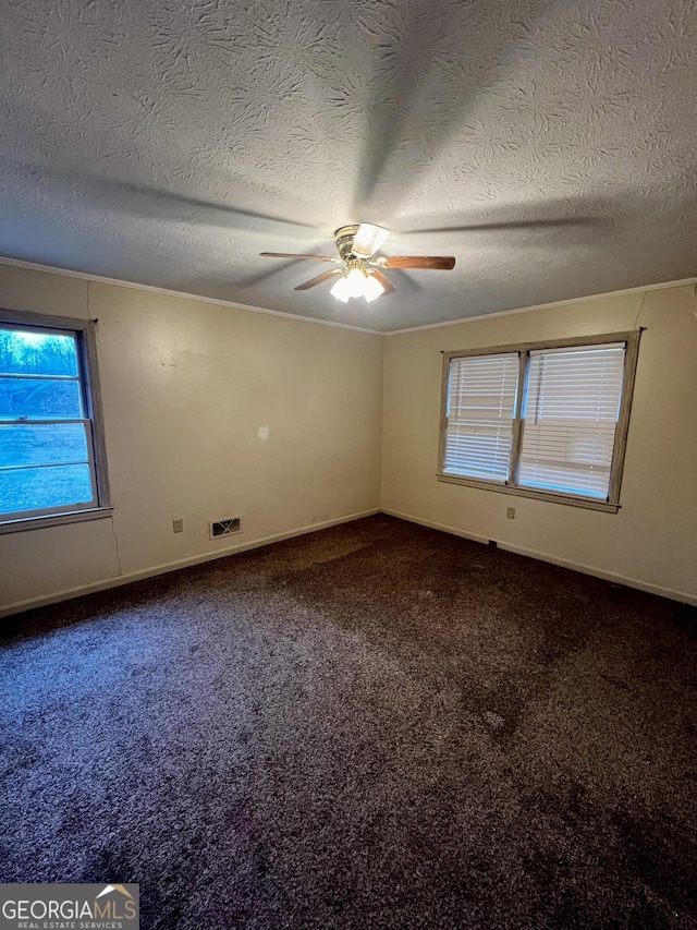 unfurnished room featuring ceiling fan, a textured ceiling, and carpet flooring