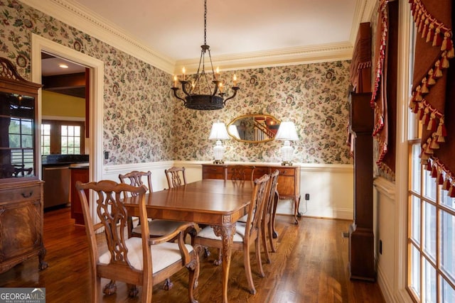 dining space featuring a chandelier, dark hardwood / wood-style floors, and ornamental molding