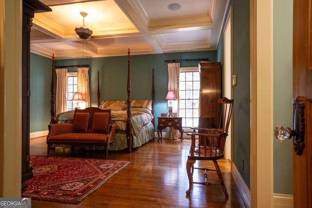 bedroom with wood-type flooring, crown molding, beamed ceiling, and coffered ceiling