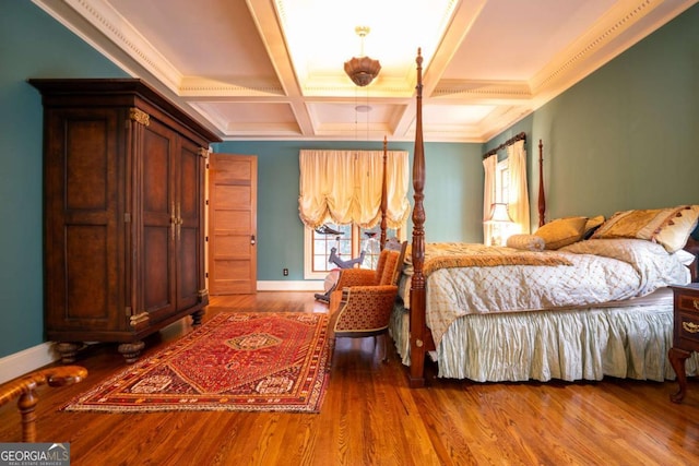 bedroom with crown molding, wood-type flooring, coffered ceiling, and beamed ceiling