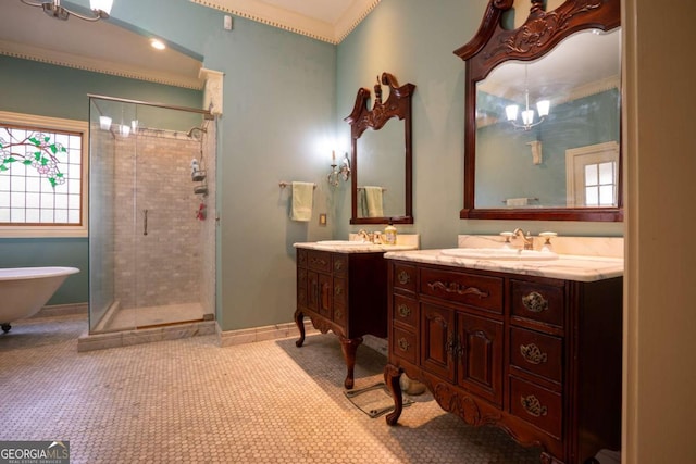 bathroom with tile patterned floors, vanity, an inviting chandelier, shower with separate bathtub, and ornamental molding