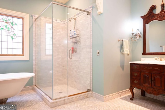 bathroom with plus walk in shower, tile patterned flooring, and vanity