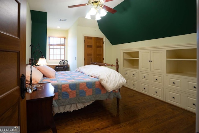 bedroom with ceiling fan, vaulted ceiling, and dark hardwood / wood-style flooring