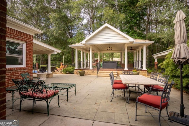 view of patio featuring a gazebo and a hot tub