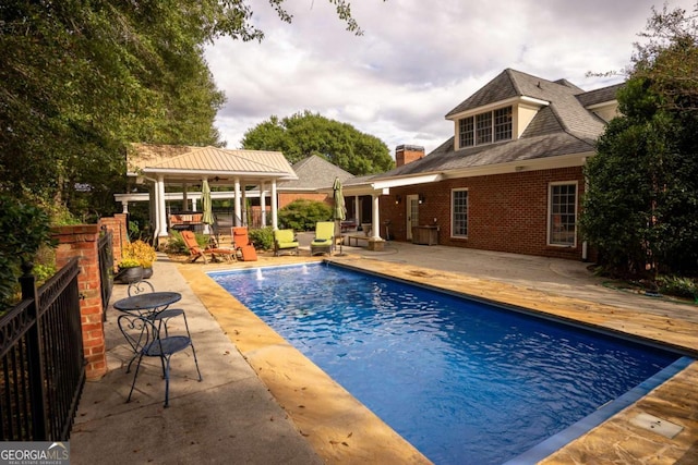 view of pool featuring a gazebo and a patio