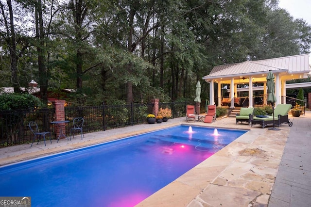 view of swimming pool with a patio area and a gazebo