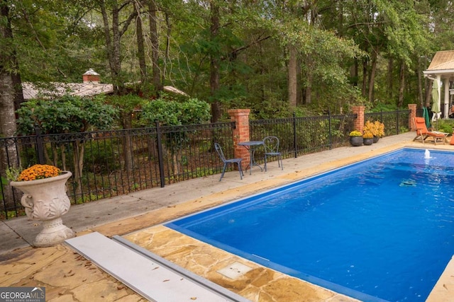 view of pool featuring a patio