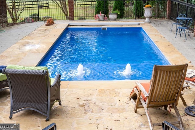 view of pool featuring a patio area