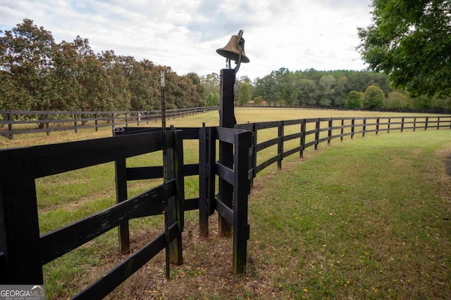 view of yard with a rural view