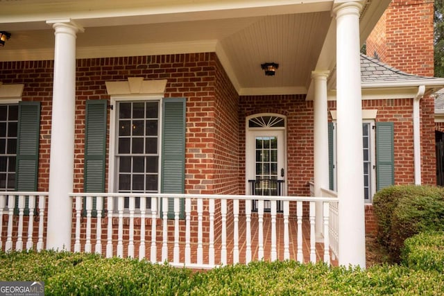 doorway to property featuring covered porch