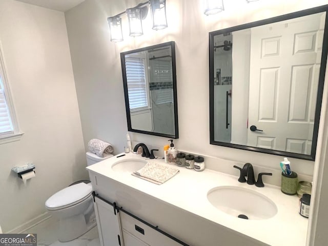 bathroom featuring toilet and vanity