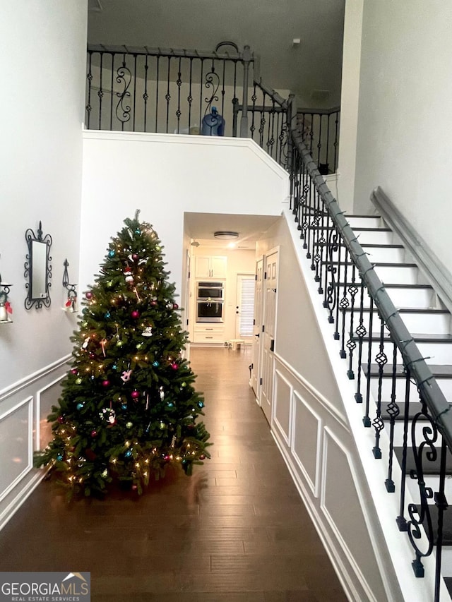 stairs with hardwood / wood-style floors