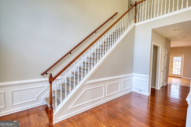 stairway featuring wood-type flooring