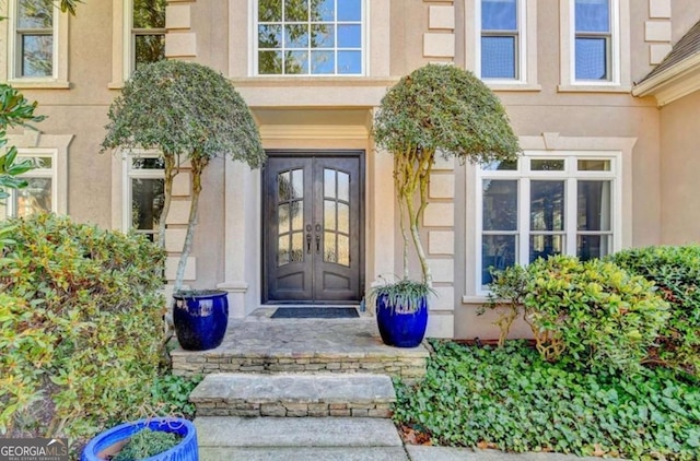 view of exterior entry featuring french doors