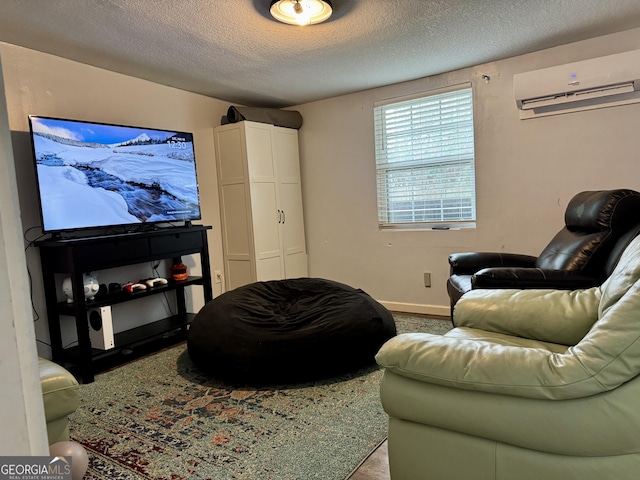 living room with a wall mounted AC and a textured ceiling