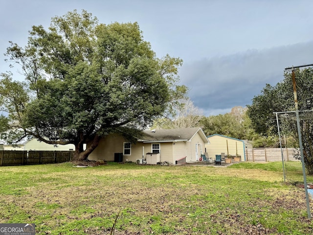 back of property with a lawn