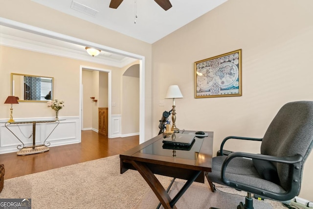 sitting room featuring ceiling fan, dark hardwood / wood-style flooring, and ornamental molding