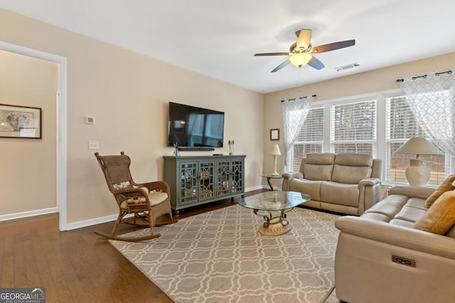 living room featuring ceiling fan and hardwood / wood-style floors